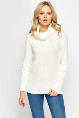 This sweater is perfect for a more casual look but a black or red pleated miniskirt like the one to the right or below might work well.